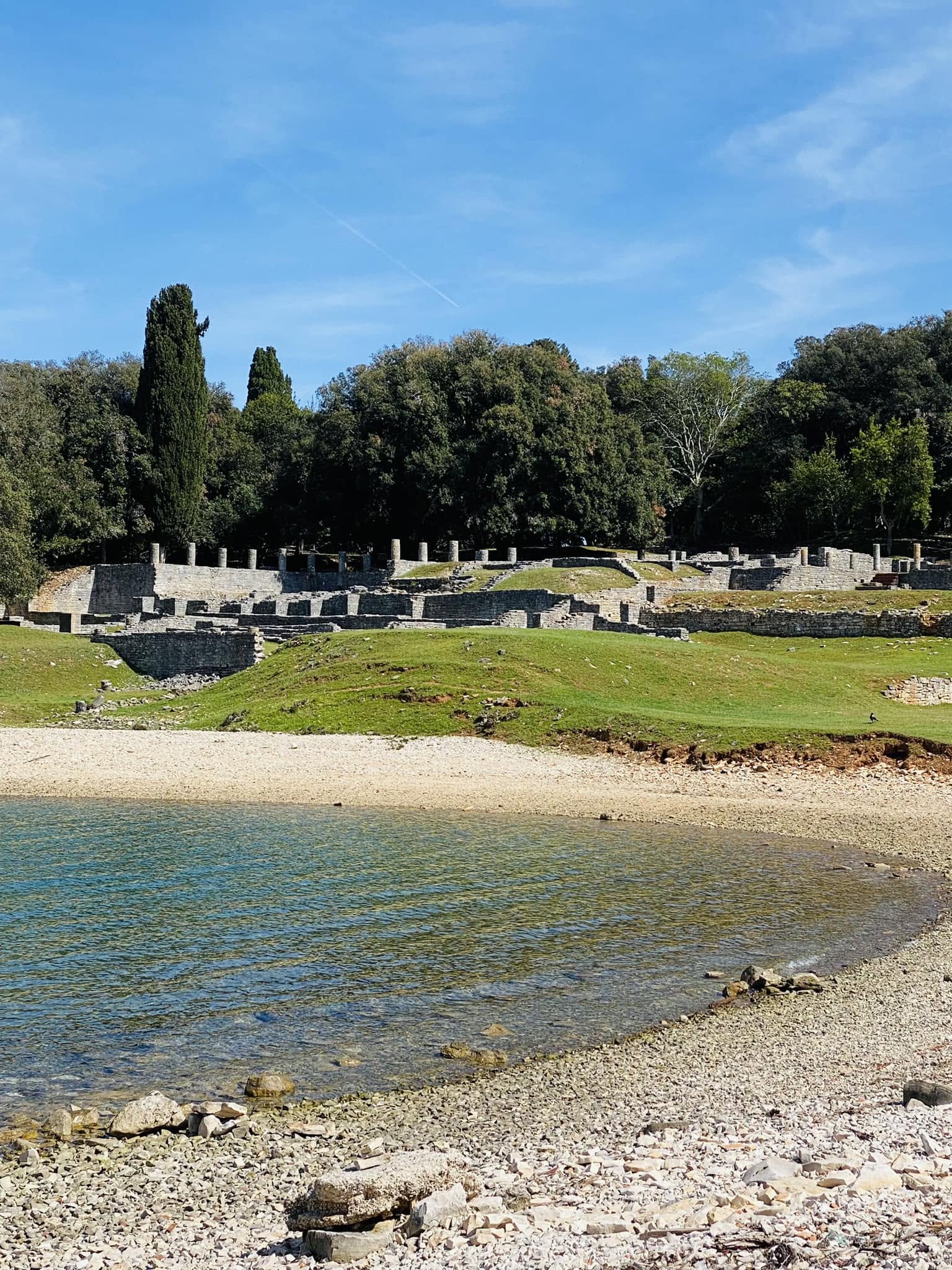 Roman ruins beside a clear Brijuni bay