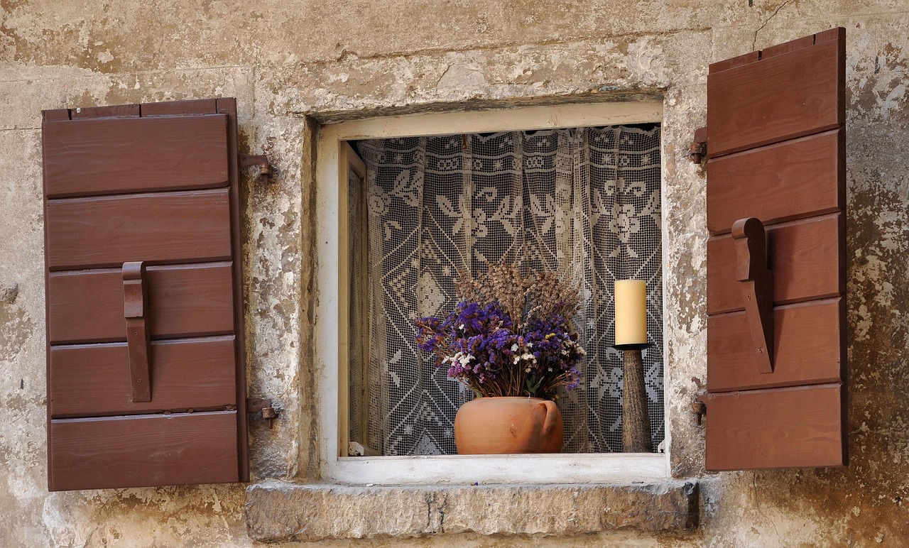 Traditional Istrian stone window with flowers