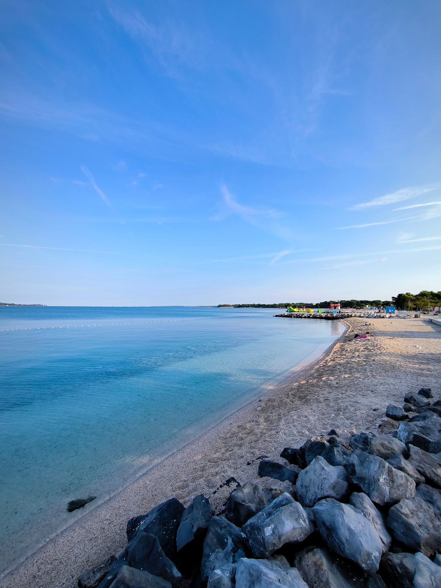 Clear Adriatic water and a pebble beach in Pula